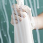 Front View Hand With Surgical Glove Spraying Disinfectant Window Min 1 150x150